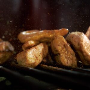 Chunks Of Meat Bouncing On Grill