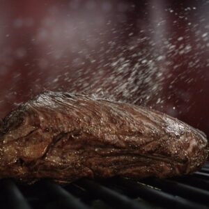 Meat Fillet Bouncing On Grill